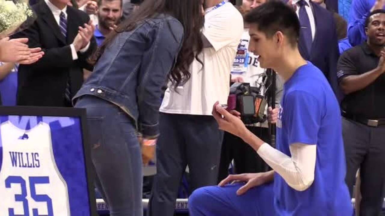 Up to the basket, then down on one knee: College hoops player proposes on court
