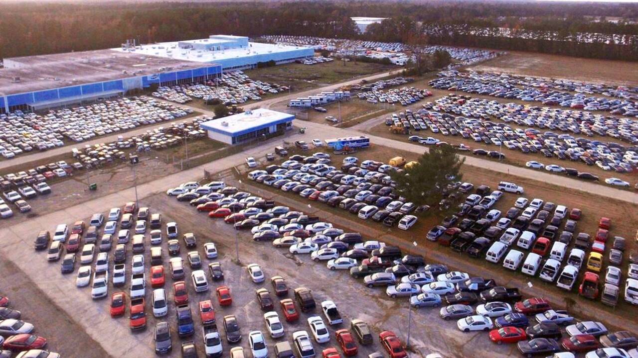 Thousands of flooded cars crowd parking lot in Lumberton