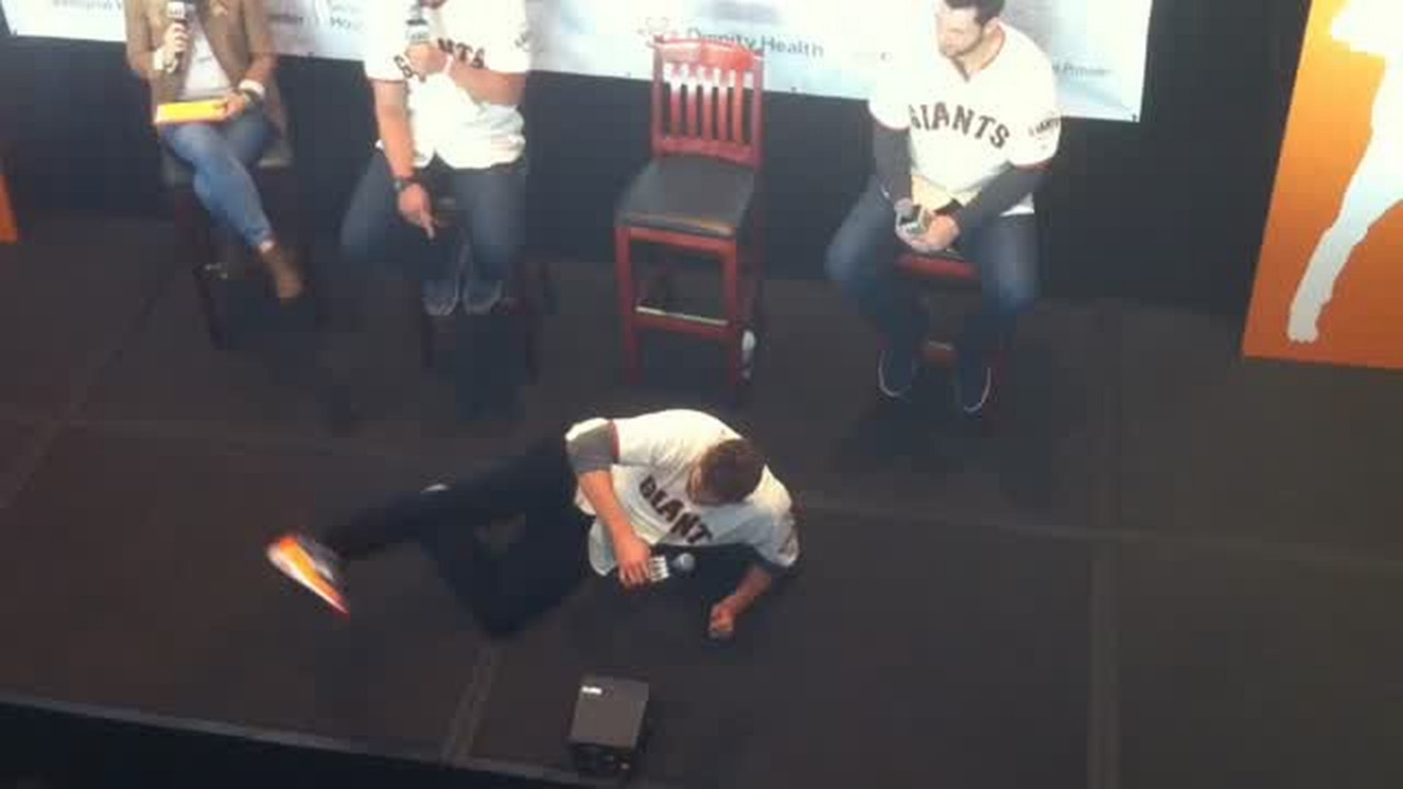 San Francisco Giant's Hunter Pence, inspired at Fan Fest, shows off his pilates moves