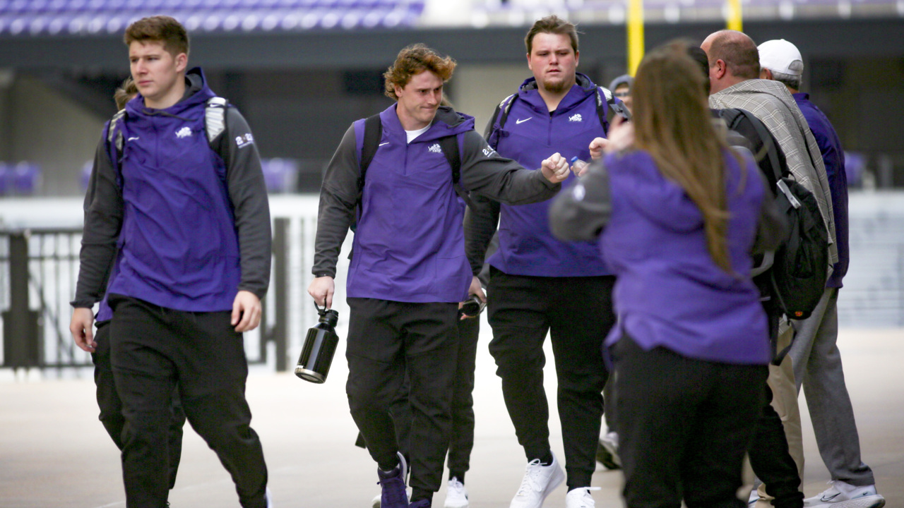 Fans cheer on TCU football players as team leaves for CFP championship game in LA