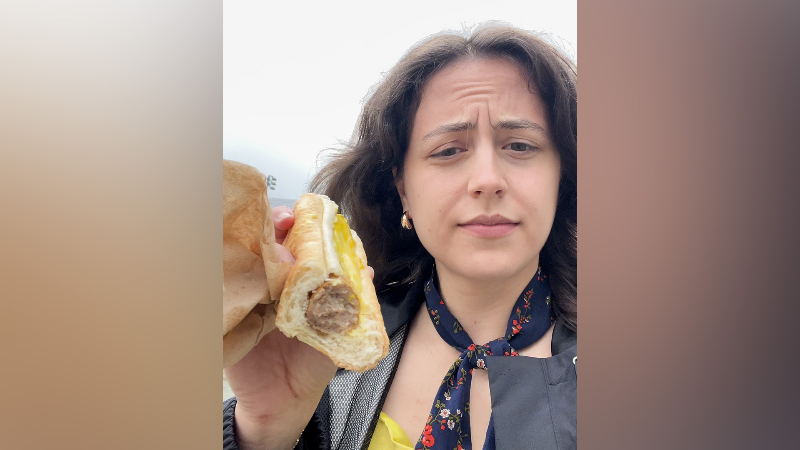 Enjoying a bratwurst on a rainy Kentucky Derby Saturday