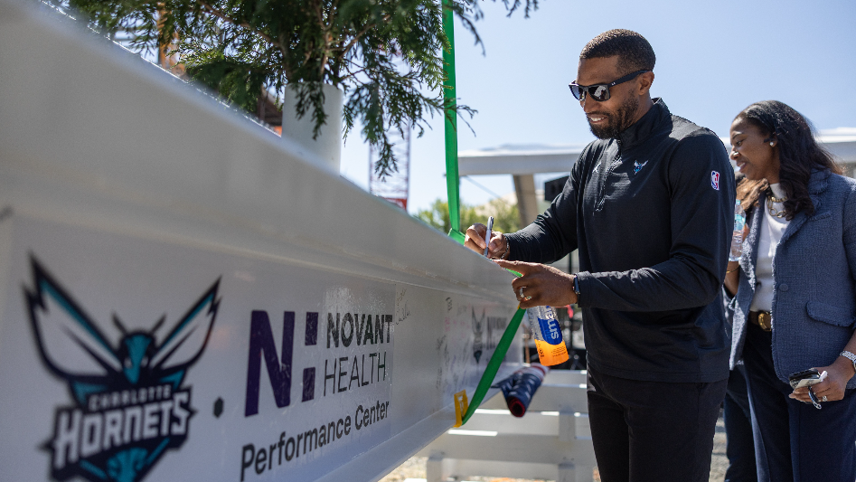 Charlotte Hornets coach Charles Lee speaks at the Topping Off Ceremony for the Novant Health Performance Center
