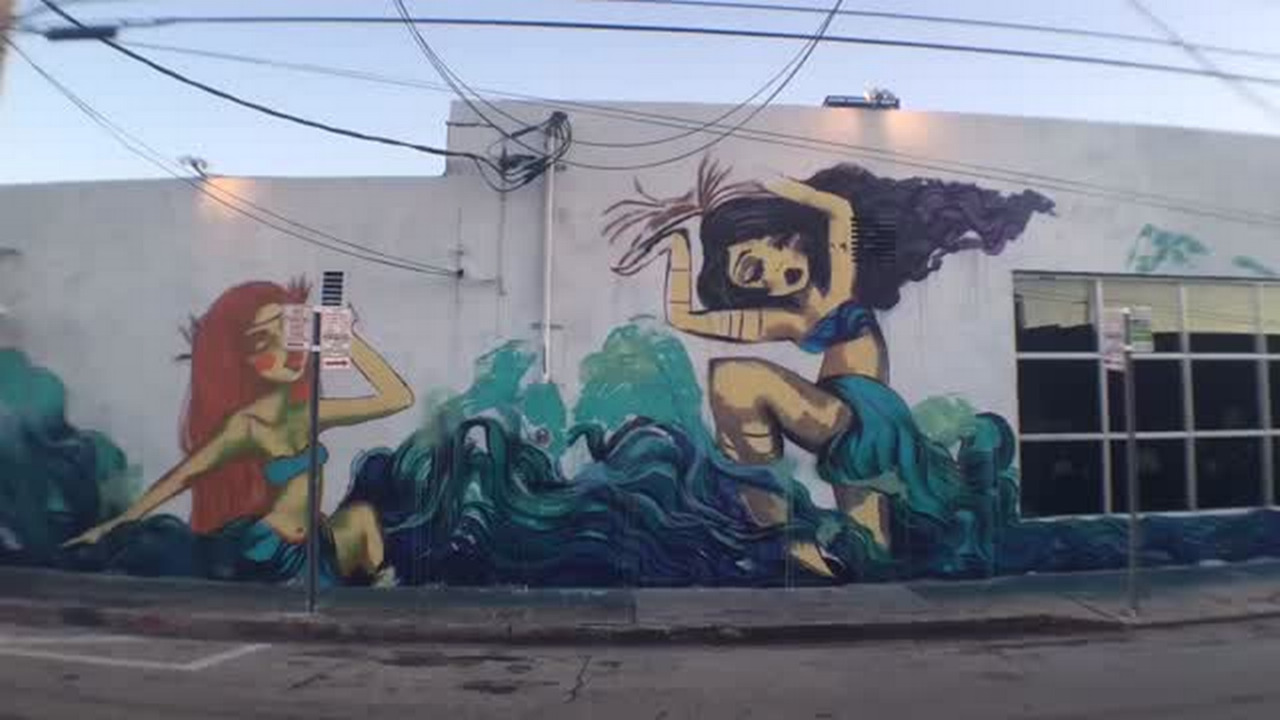 Video: Artist paints mural for Miami Book Fair