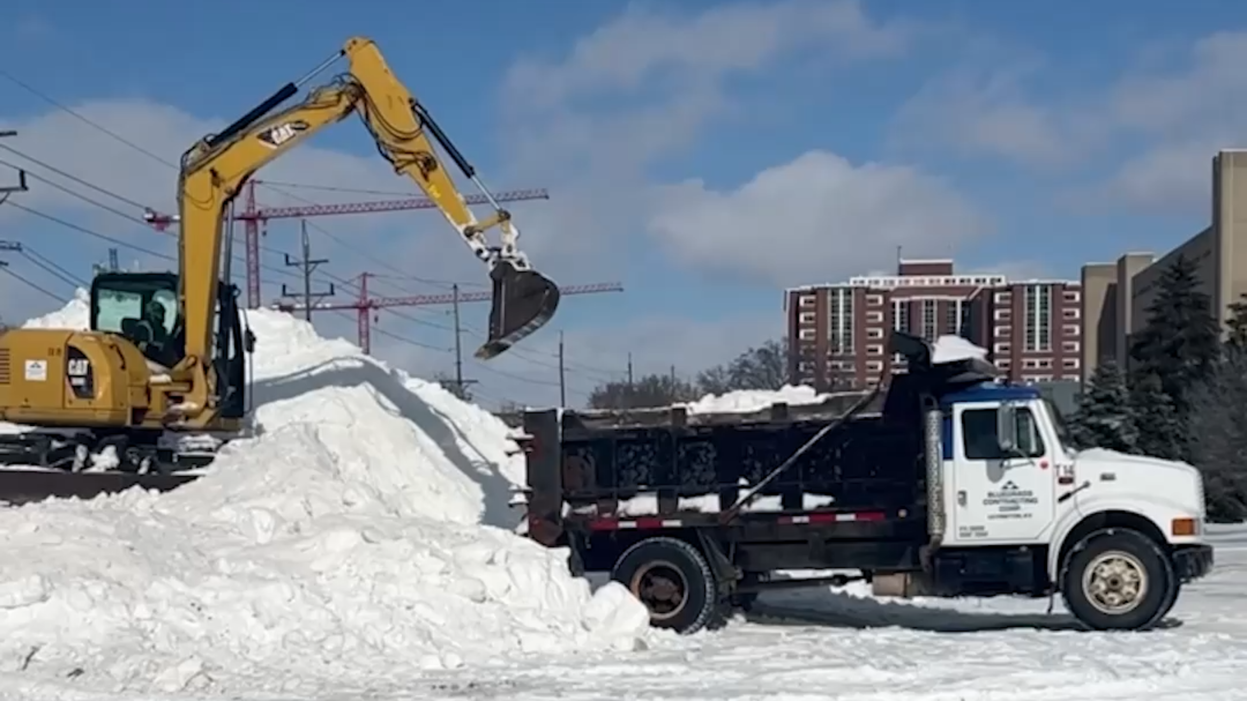 Workers clear snow on University of Kentucky's campus