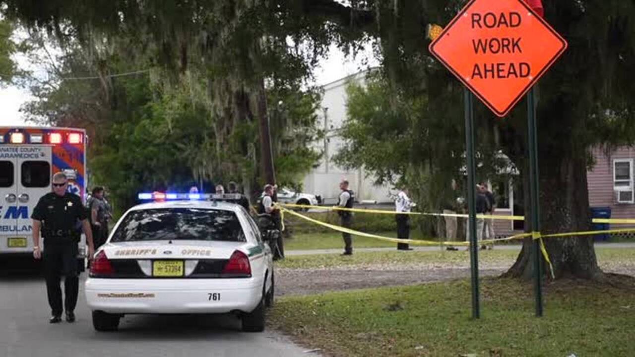 Manhunt underway for possible suspect in double slaying