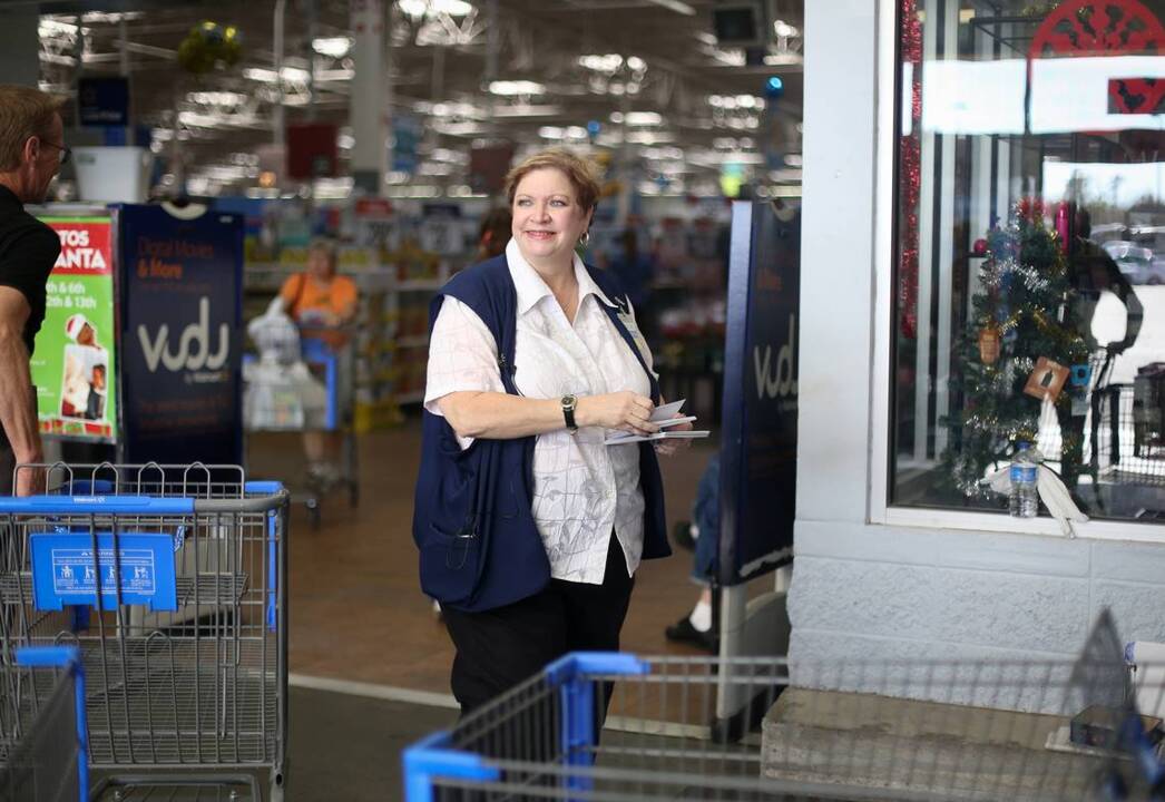 Season's greeter: Katrina inspired Wal-Mart greeter to hand out Christmas cards  