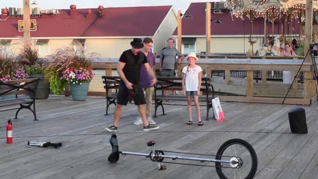Watch as boardwalk entertainer Nick Pike performs dangerous stunts at Barefoot Landing 