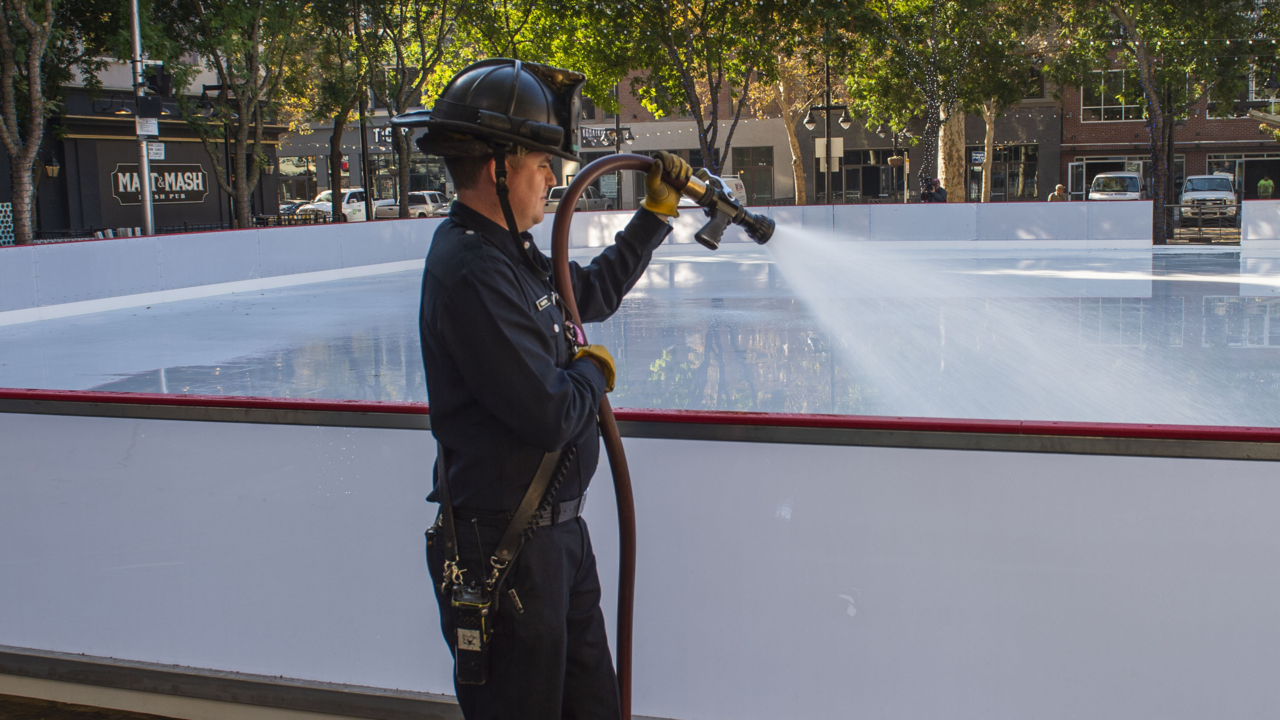 Drone view shows firefighters help freeze bigger ice rink in downtown Sacramento