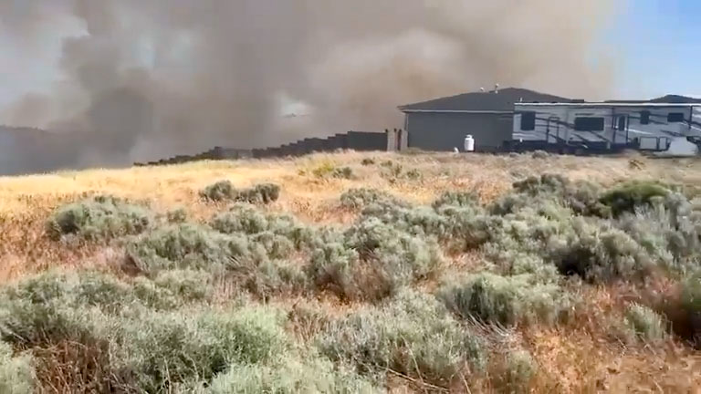 Raging wild fire threatens Tri-Cities homes