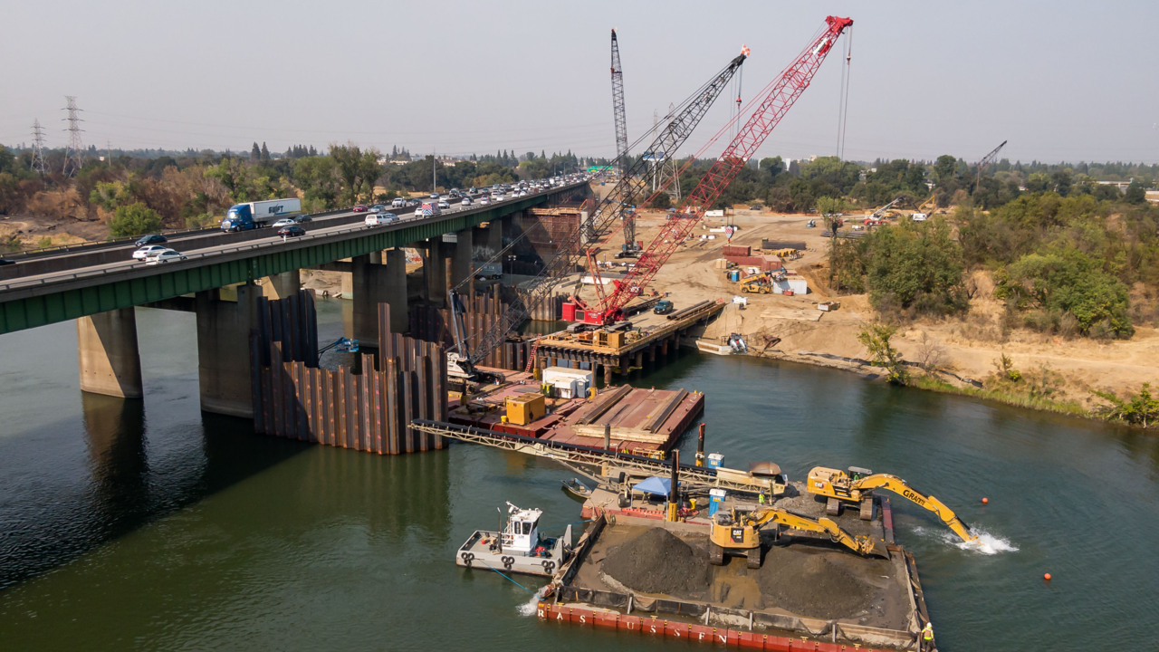 Why are there cranes under the Capital City Freeway at the American River in Sacramento?