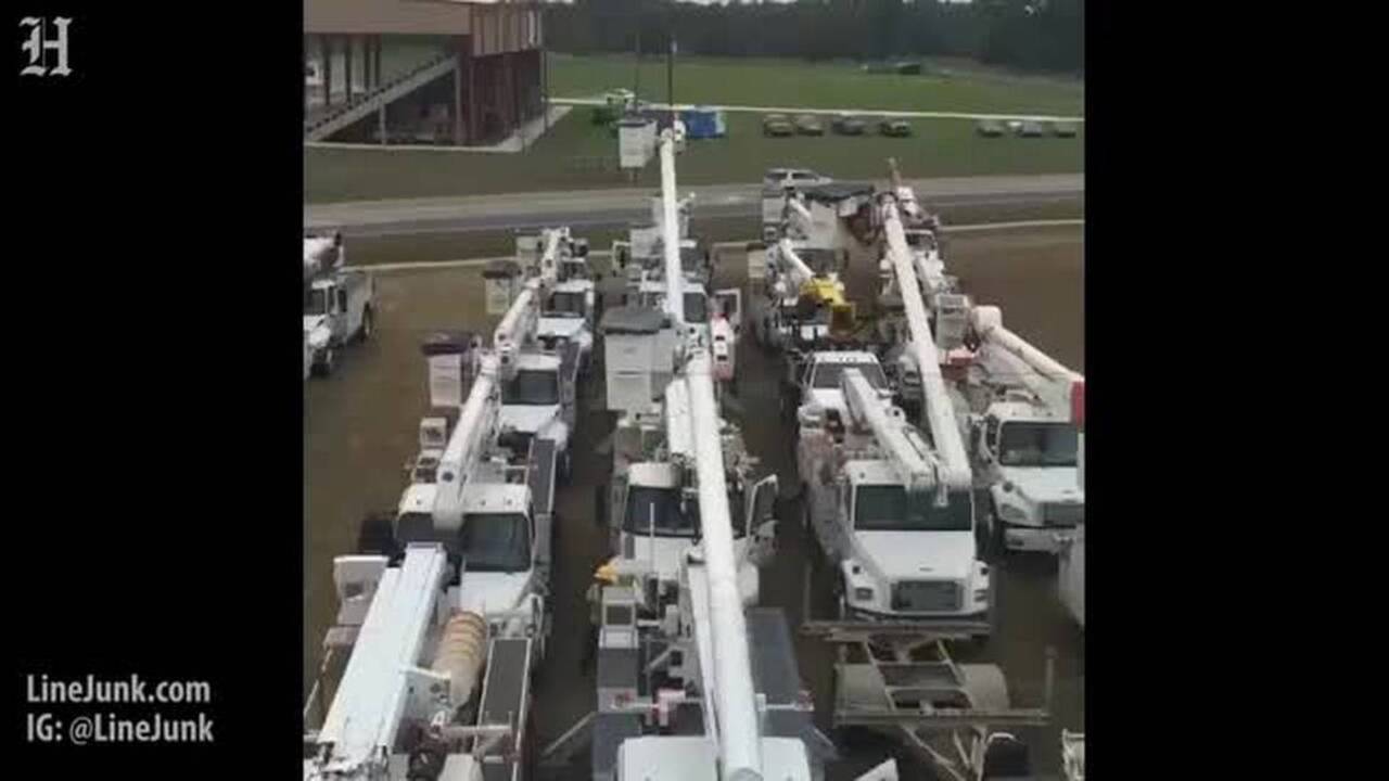 Dozens of bucket trucks stage ahead of Hurricane Matthew