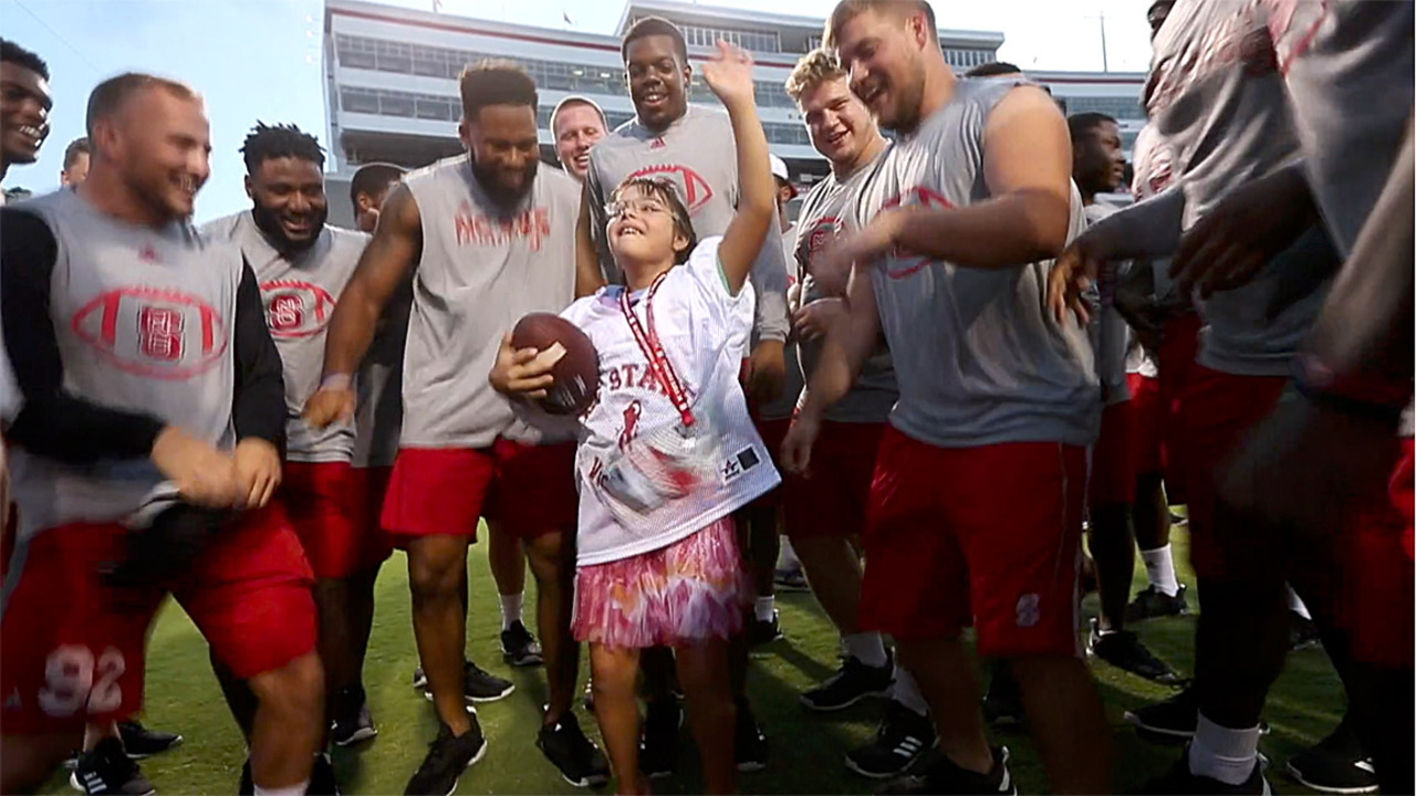 ‘Best thing we’ve ever done’ -- NC State football hosts individuals with Down syndrome