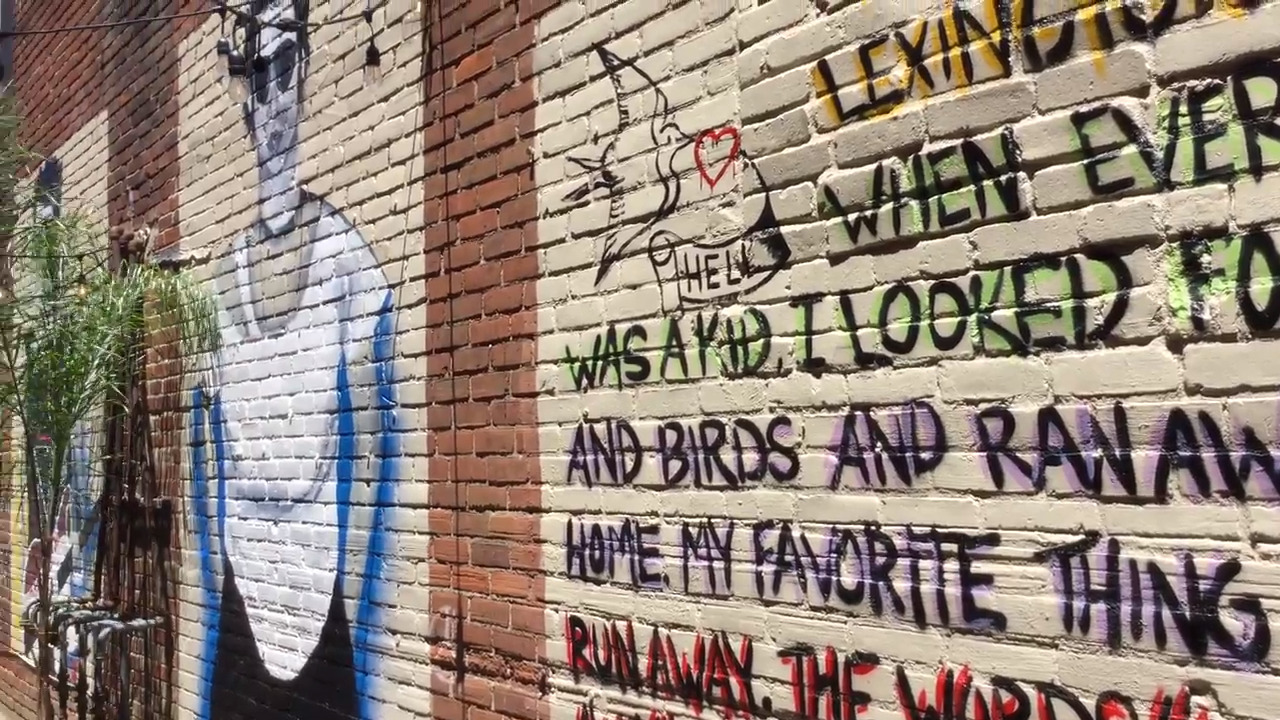Montessori goes punk. Students paint mural of famous rocker from Lexington.