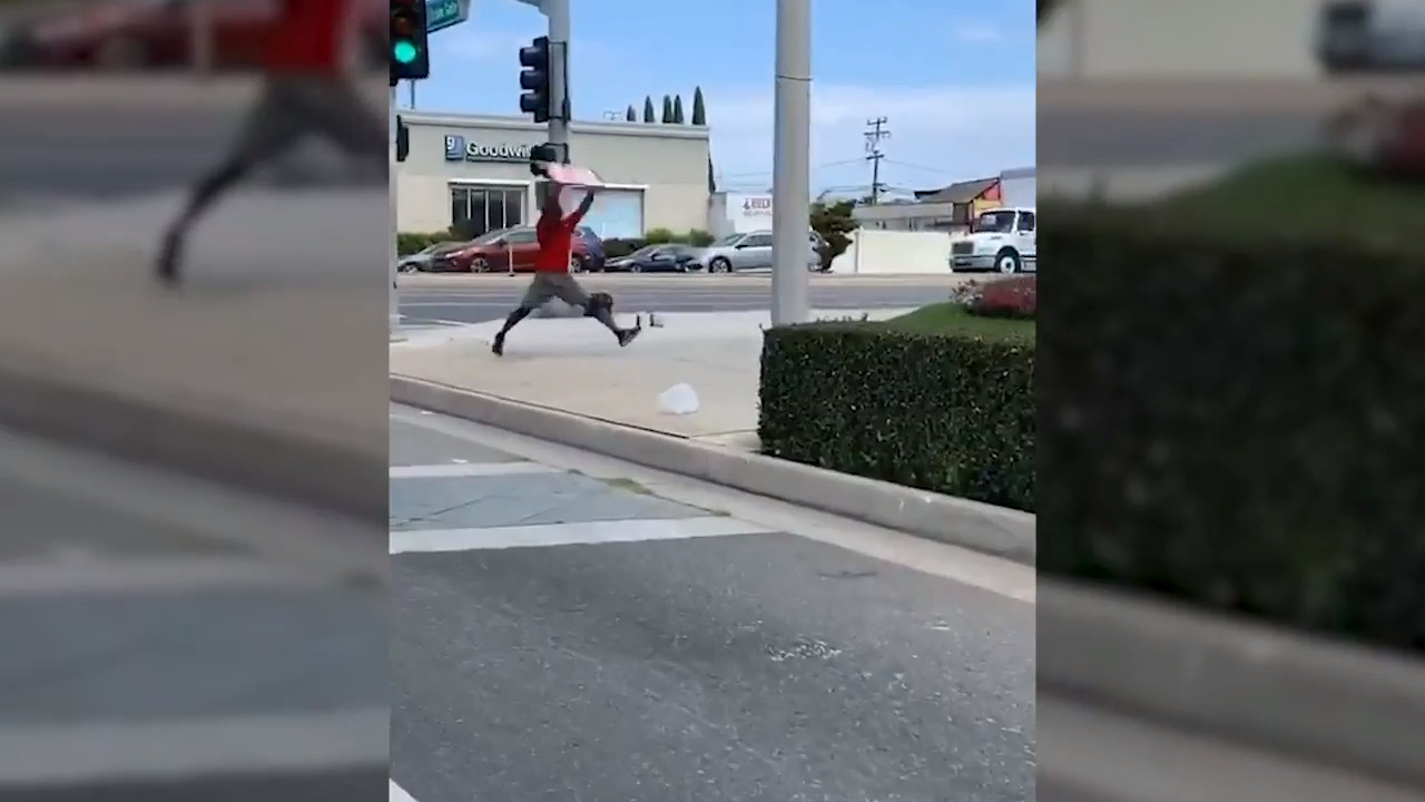 Mattress store worker impresses drivers with sign-spinning skills