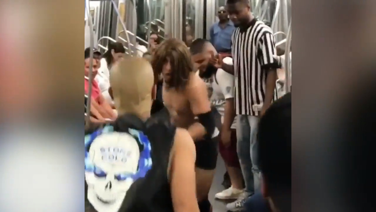Triple H, Stone Cold impersonators stage hilarious wrestling match on New York subway