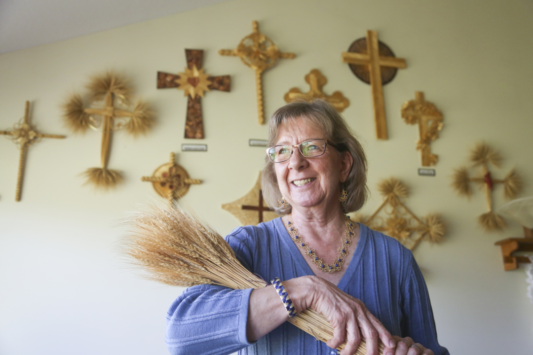 With every cross, she shares her spirituality through golden wheat
