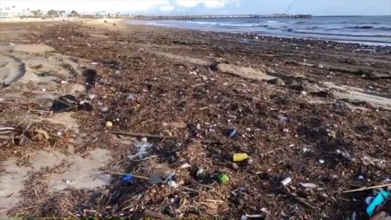 See post-storm garbage piled up on Seal Beach
