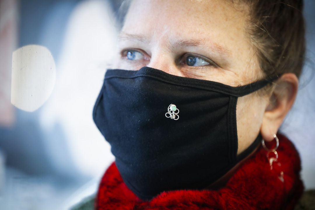 Locally made mask pins at Savané Silver