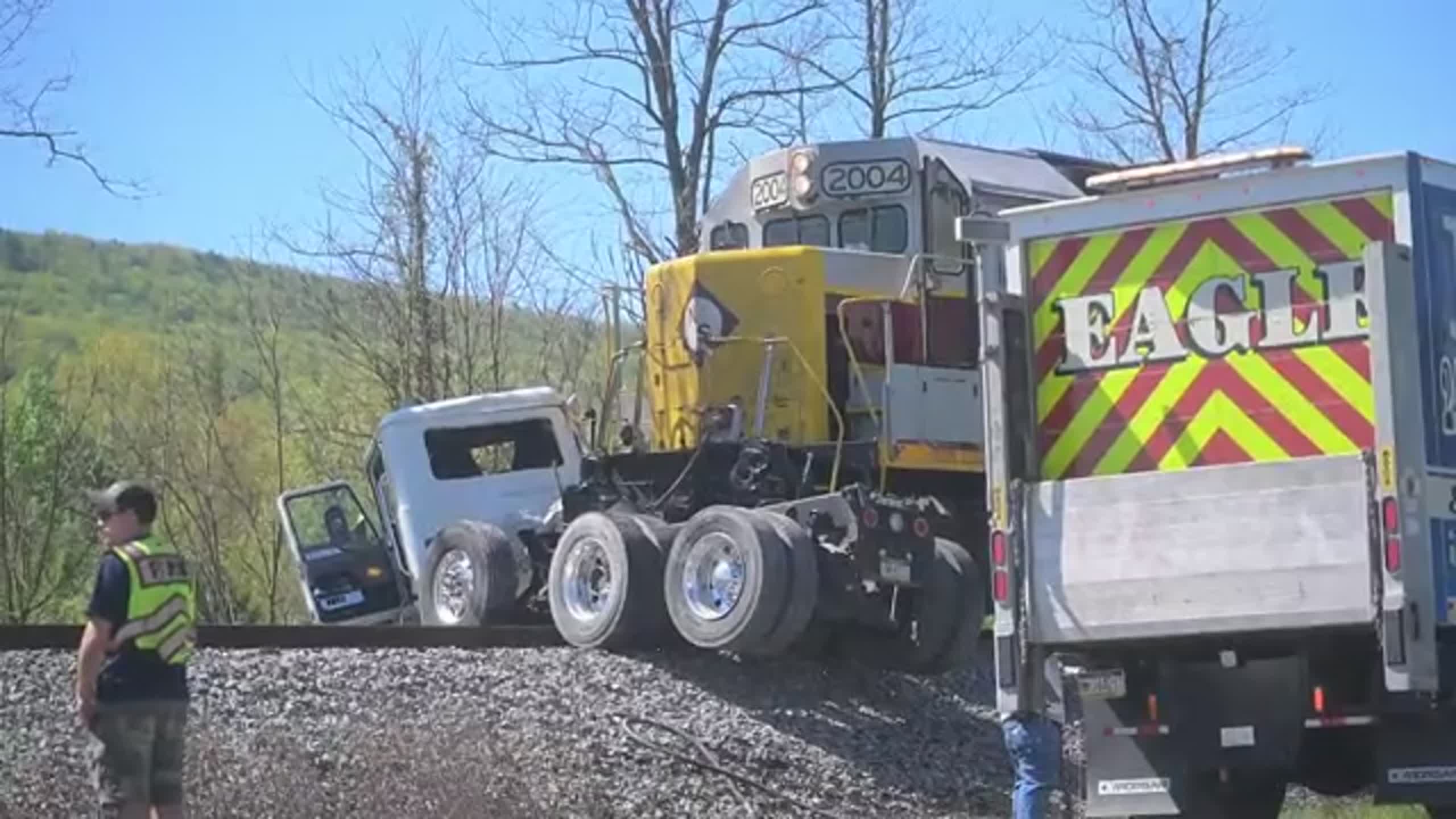Emergency crews work on scene after train, dump truck collide in Centre ...