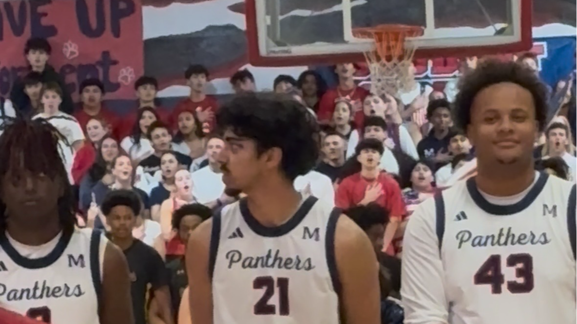 San Joaquin Memorial crowd signs the national anthem