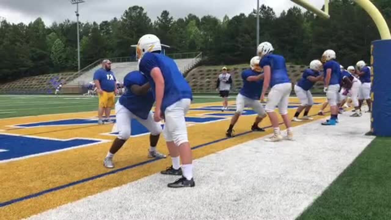 Fort Mill football team gets first taste of a new coach and new system