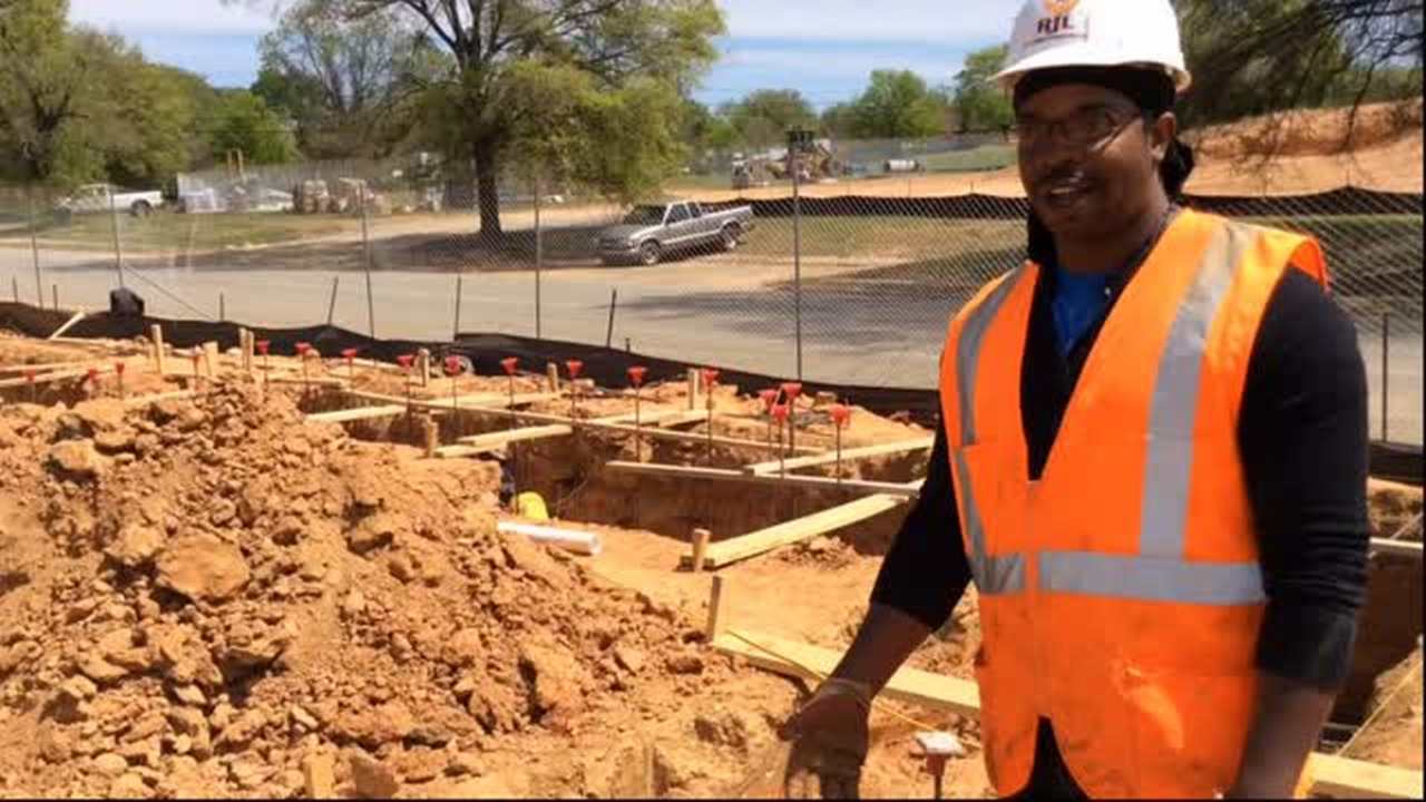 On the bottom rung, but he’s looking up