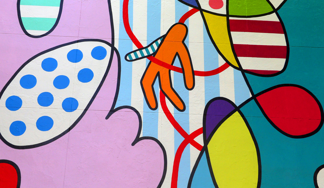 Muralist paints building facade for upcoming Artbeat celebration