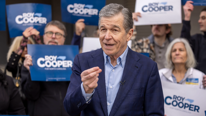 Roy Cooper addresses NC prison releases while casting early vote for Senate