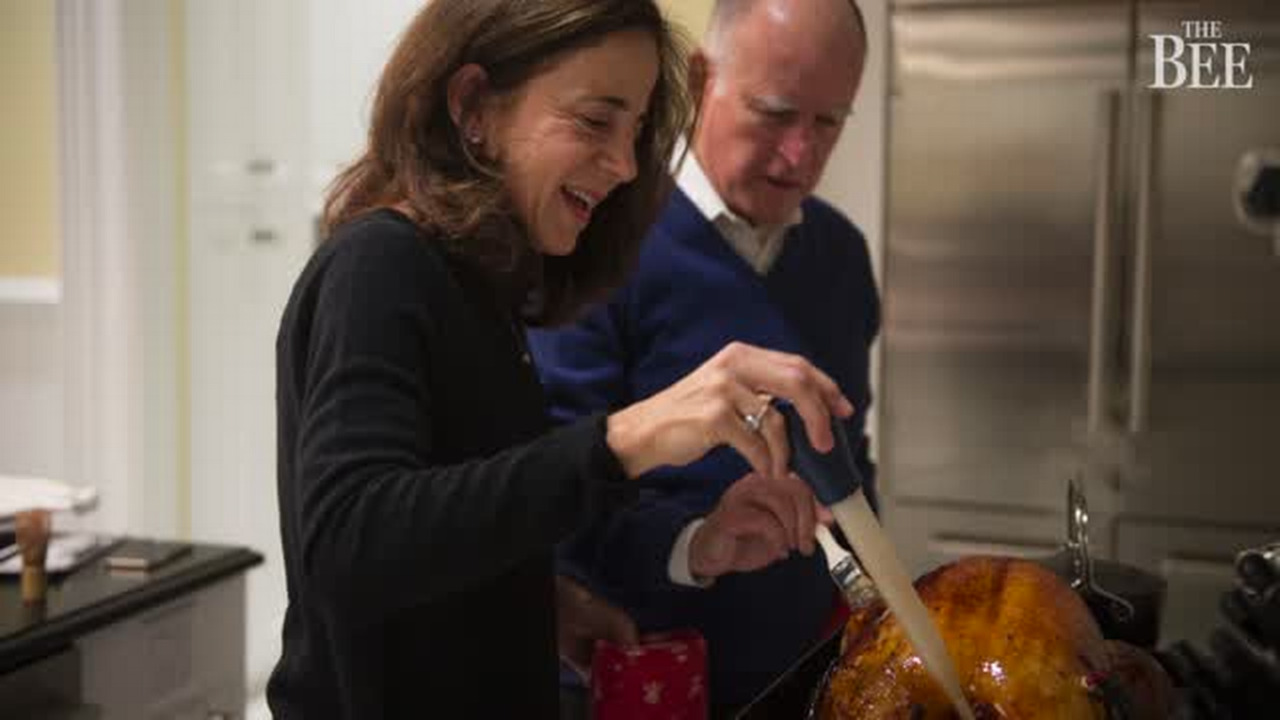 Gov. Brown helps with the Christmas turkey in the newly renovated Governor’s Mansion